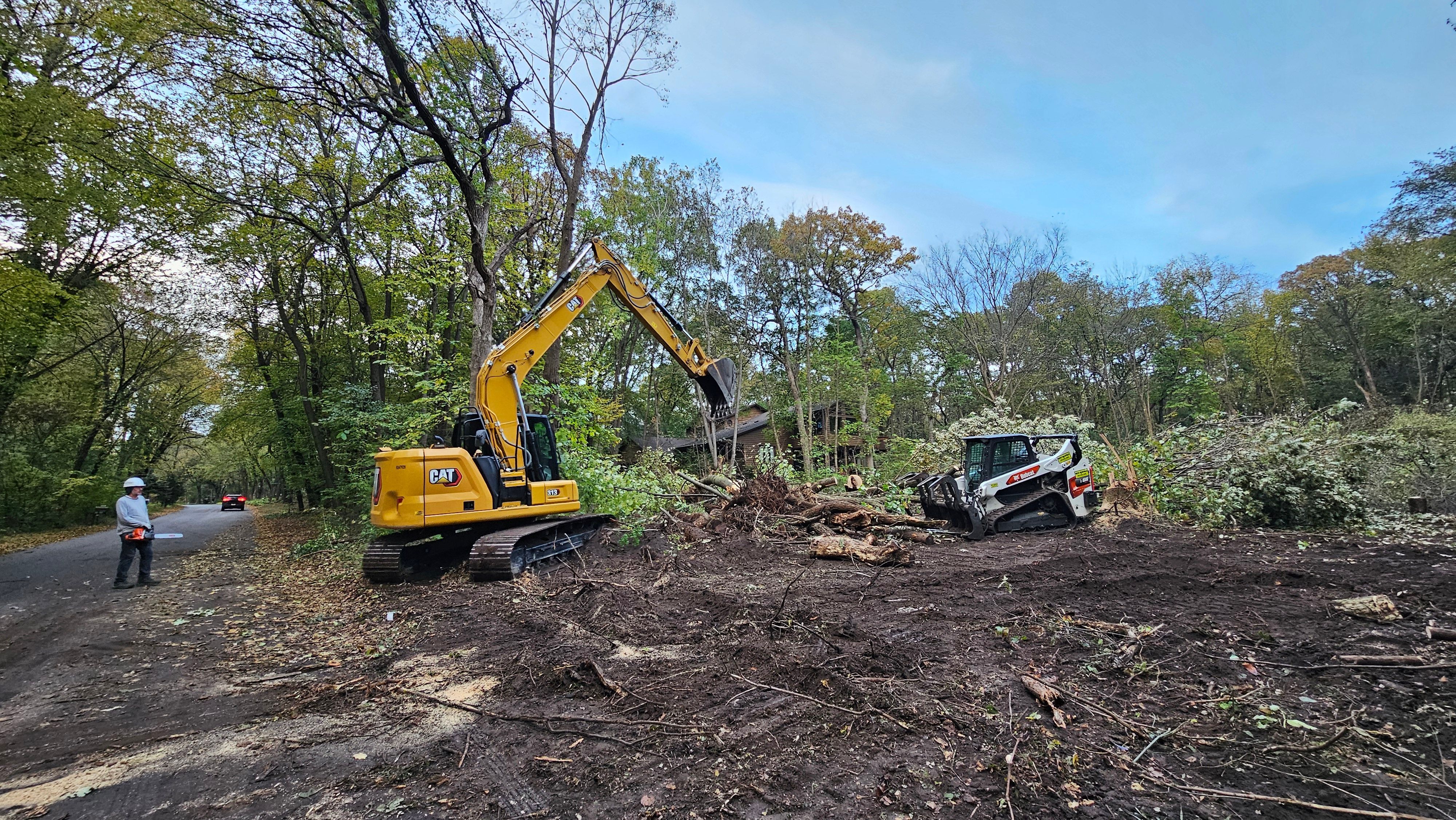 CAT Excavator and Bobcat on job site